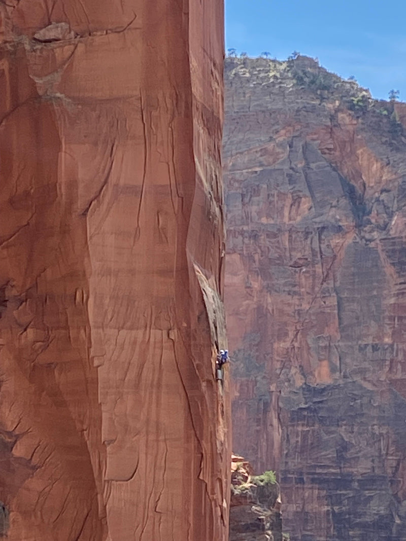 Climbers high up on Desert Shield, a rock climb in Zion National Park, Utah.